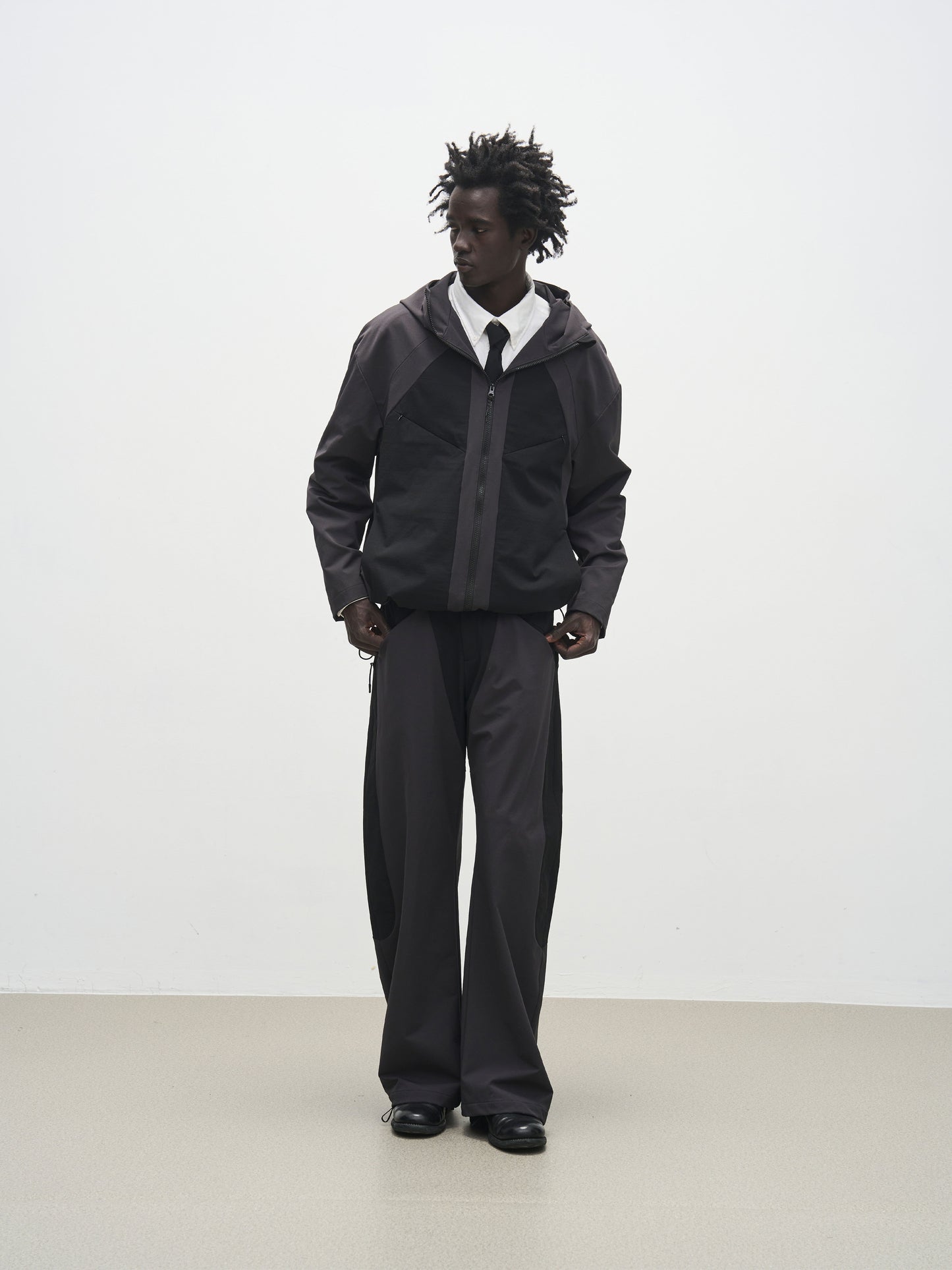 'Triangle' panel loose straight-leg softshell casual trousers