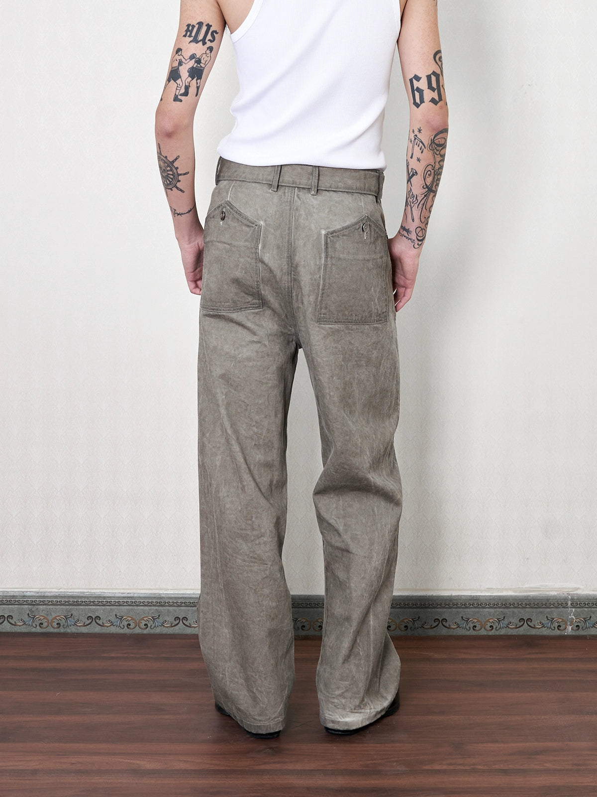 'Gneiss' mud dyed distressed belted trousers