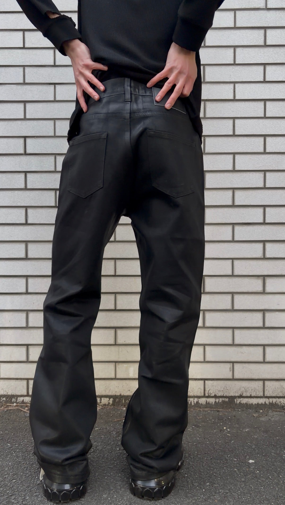 Coated distress bootcut jeans