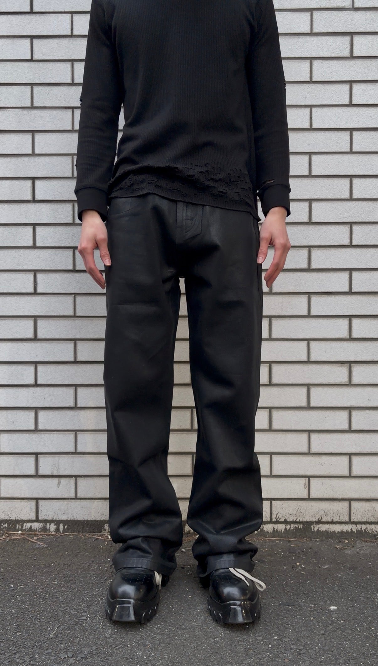 Coated distress bootcut jeans