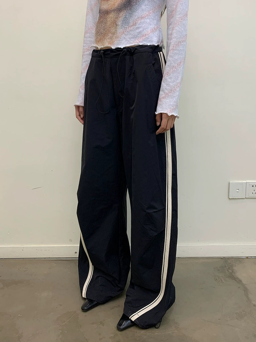 CONTRASTING LEATHER STRIPE TRACK PANTS