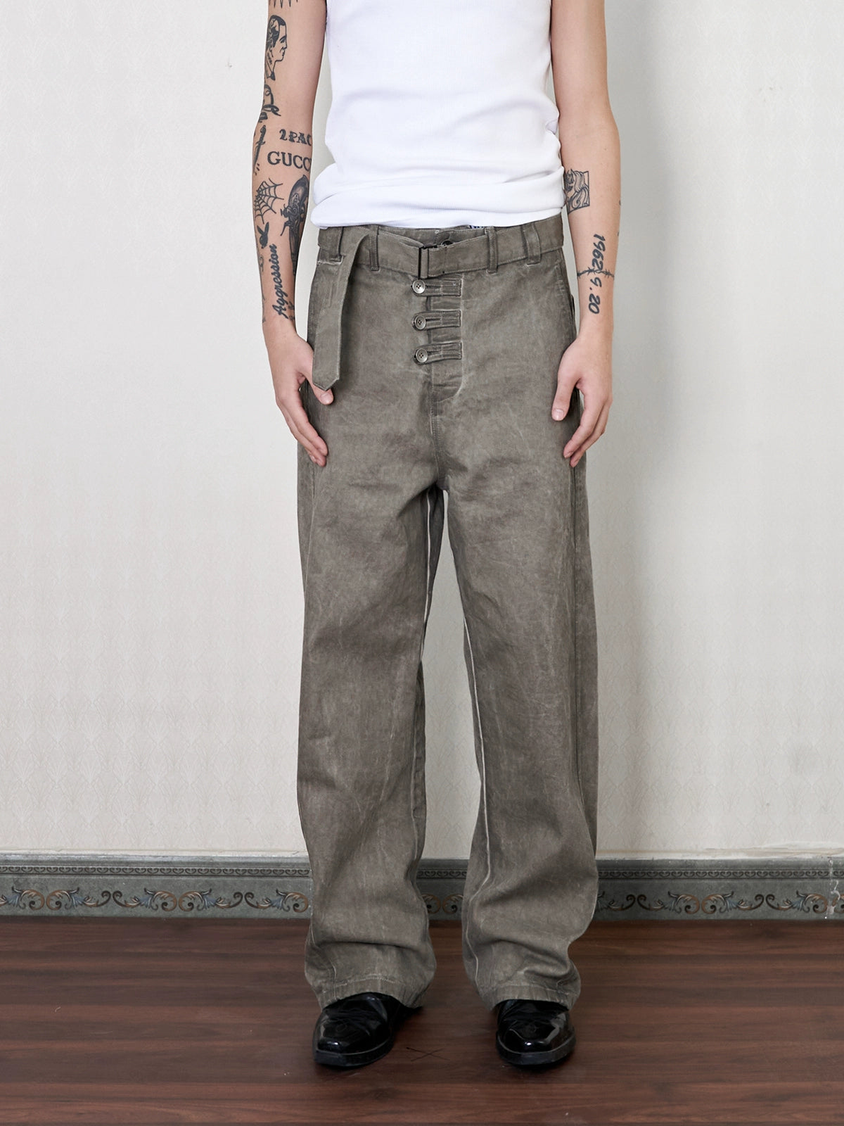 'Gneiss' mud dyed distressed belted trousers