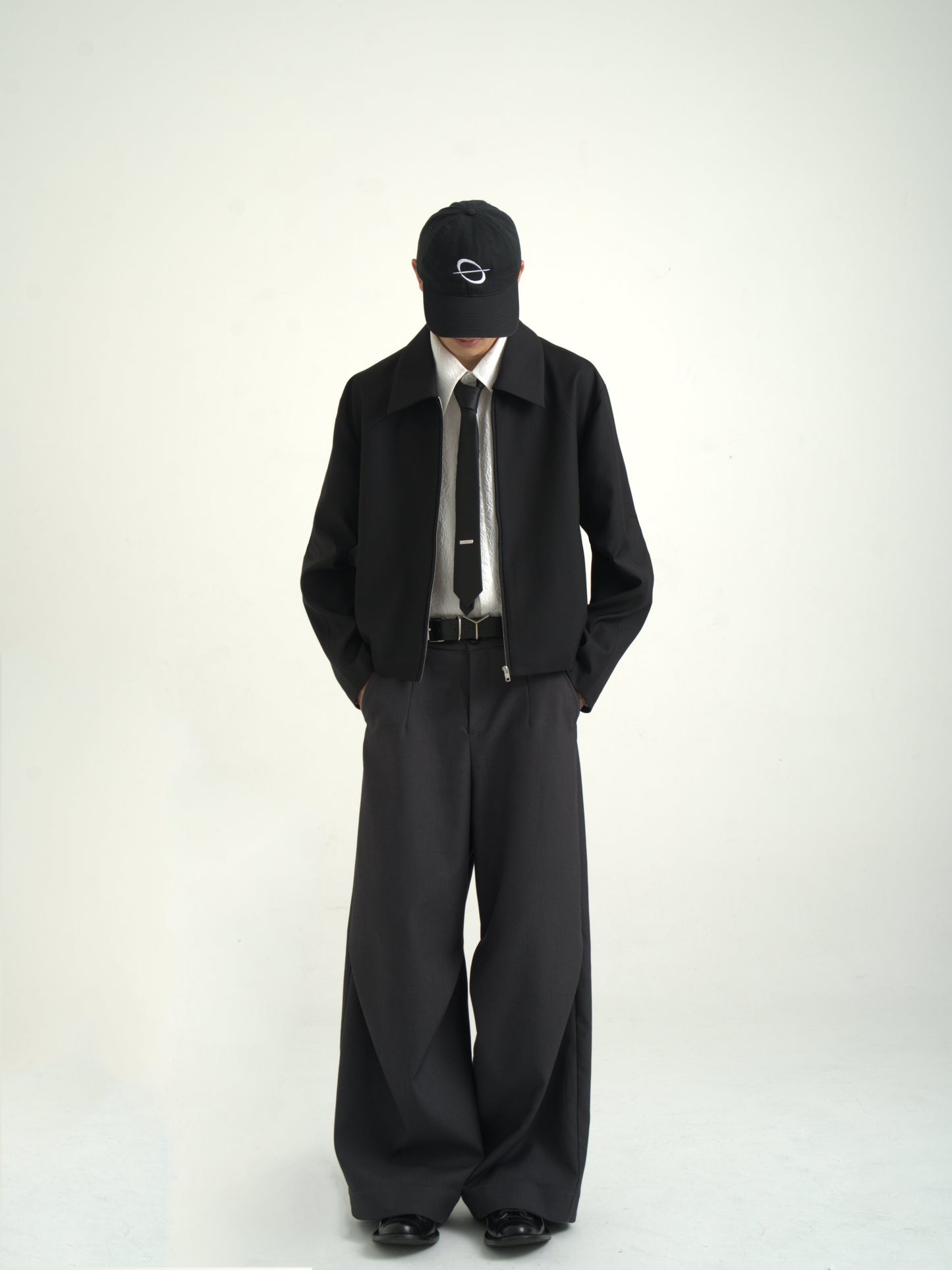 Diagonal pleats wide dark trouser