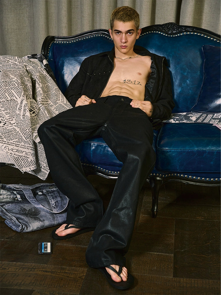 Coated distress bootcut jeans