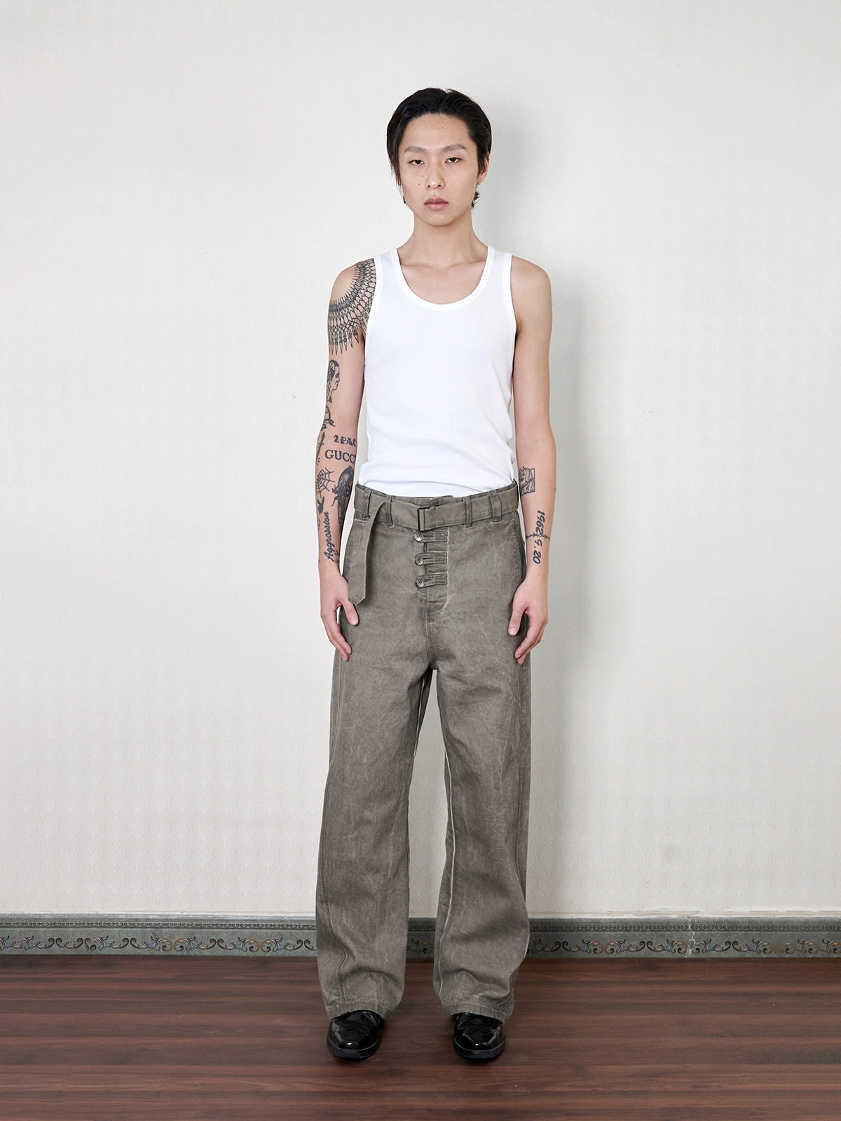 'Gneiss' mud dyed distressed belted trousers