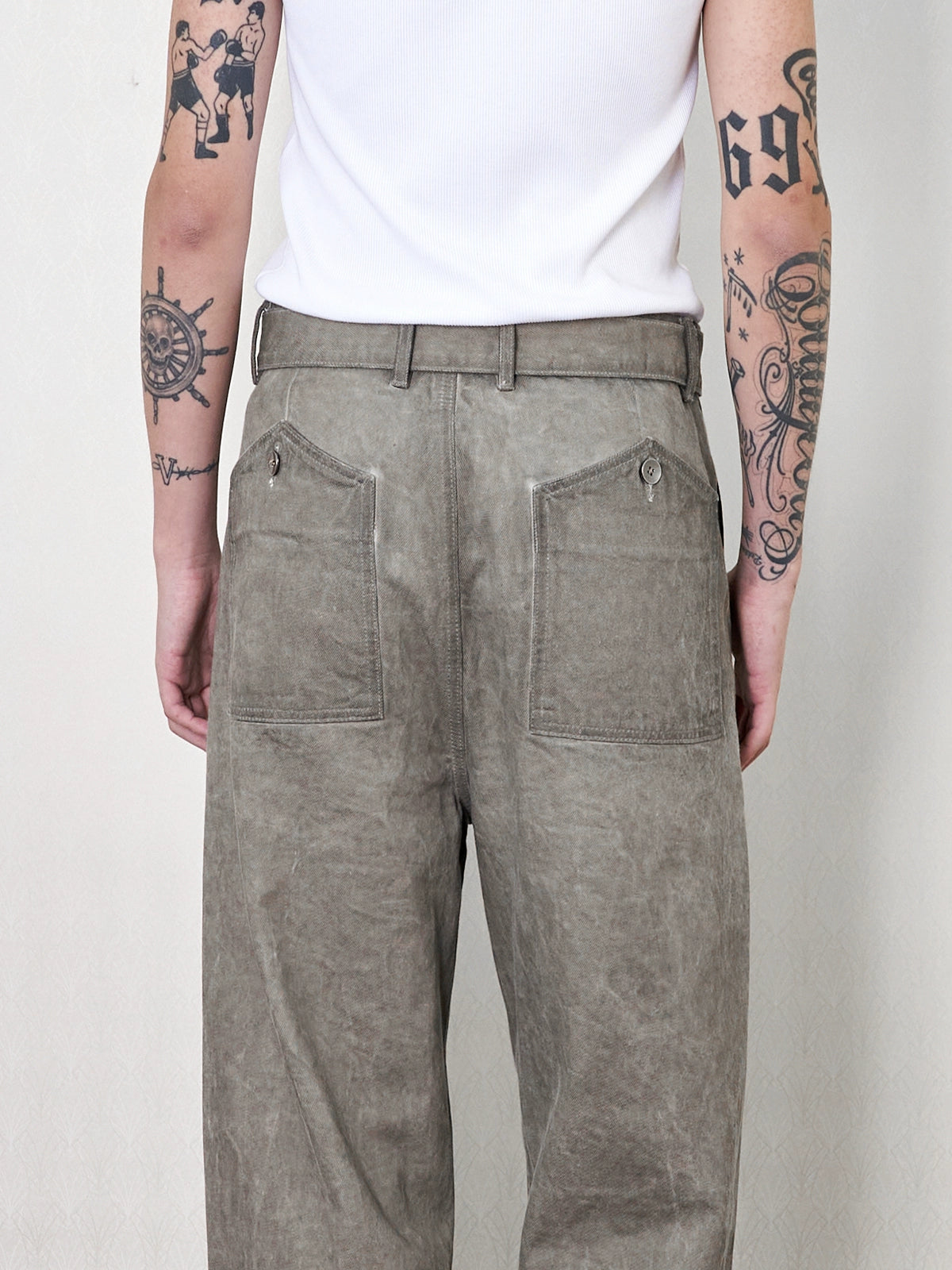 'Gneiss' mud dyed distressed belted trousers