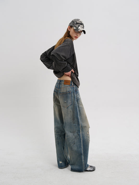 Hand wiped hole jeans
