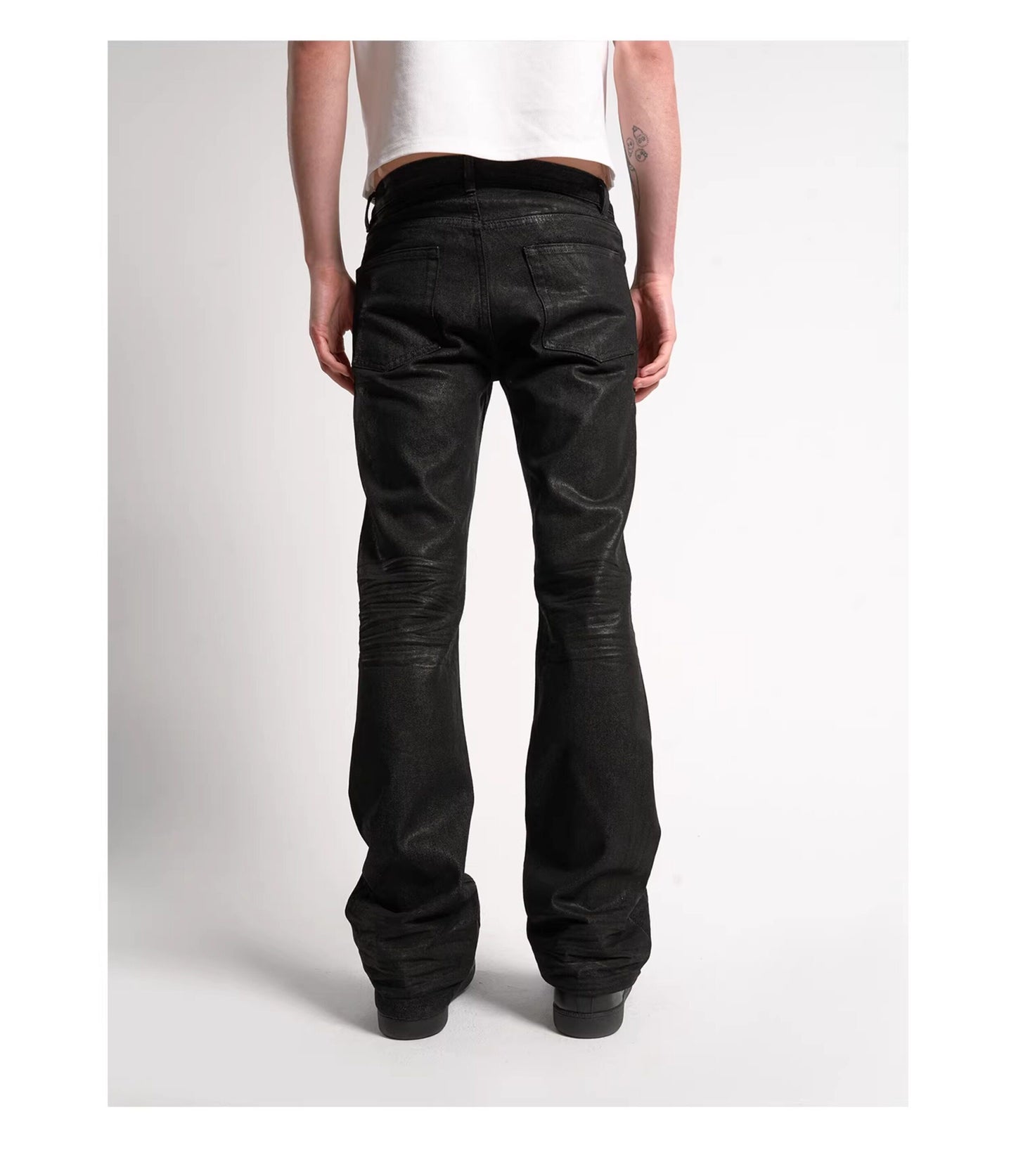 Wax coated bootcut jeans