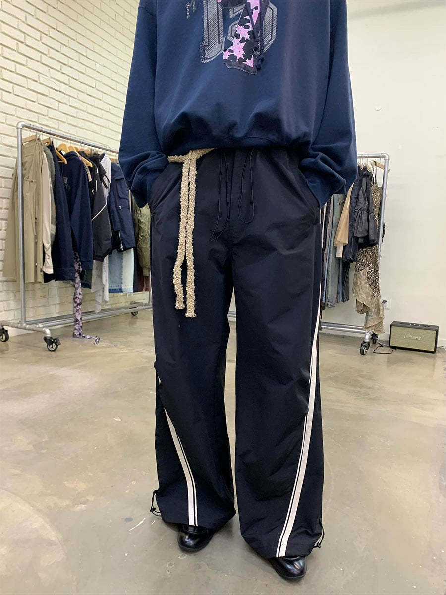 CONTRASTING LEATHER STRIPE TRACK PANTS